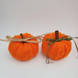 crochet pumpkins in a variety of fall colors with raffia and a cinnamon stick stem, fall table decorations, Thanksgiving decorations