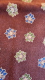 brown quilters cotton fabric by the yard with green and blue flower shapes, Arabesque by Claudia Pfeil for Benartex style #1246