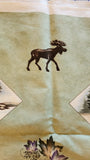 Wildlife sage green fabric panel with bear, moose, canoe, leaves, Canoe Country by Holly Taylor for Moda