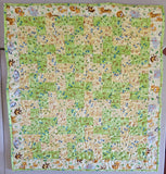 jungle themed animal quilt with elephant, giraffe, and lion for new baby or baby shower gift, tummy time quilt