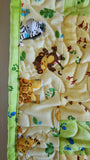 jungle themed animal quilt with elephant, giraffe, and lion for new baby or baby shower gift, tummy time quilt