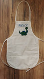 white toddler child apron / paint smock with dinosaur design custom personalized embroidered apron