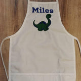 white toddler child apron / paint smock with dinosaur design custom personalized embroidered apron